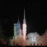 Shenzhou-21 launch showing Long March 2F rocket lifting off from Jiuquan Satellite Launch Center.